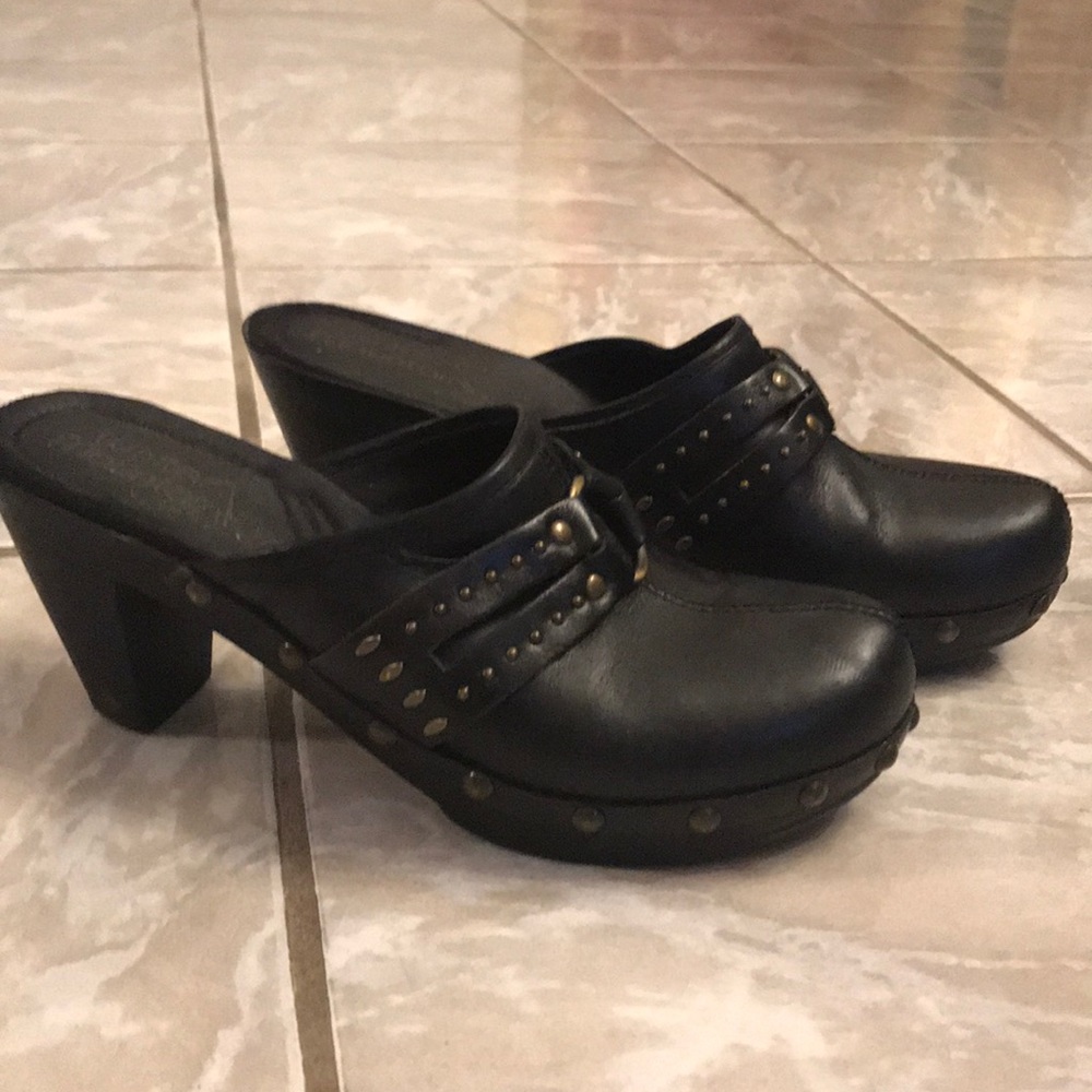 Black clogs white mountain gold embellishment